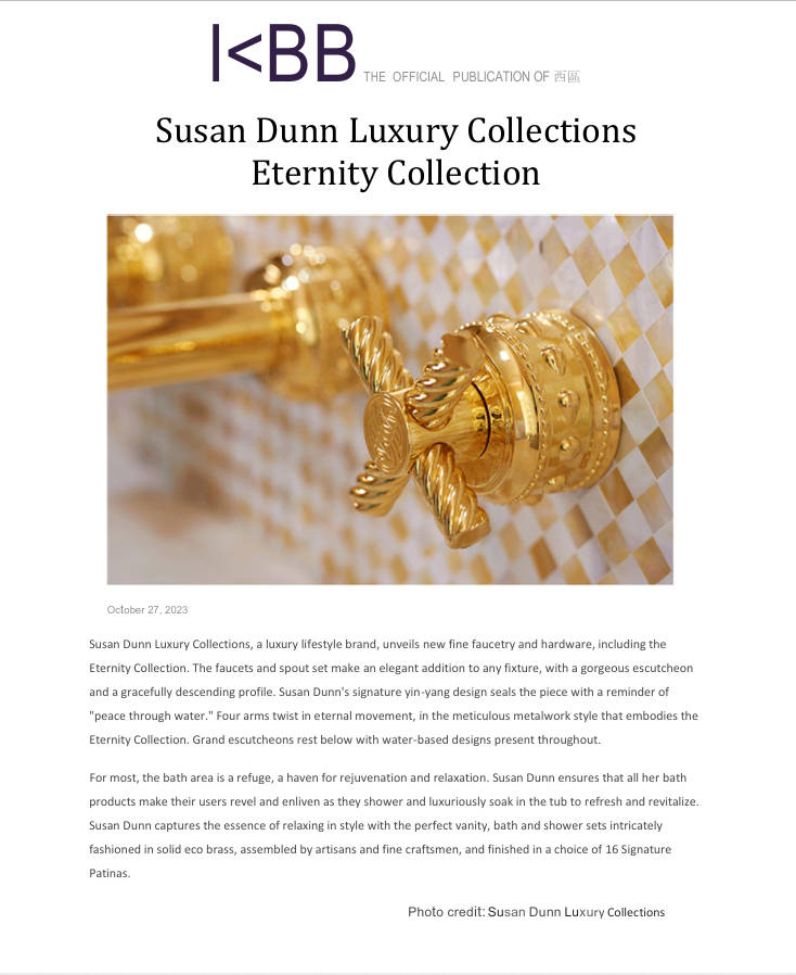 Gold ornate faucet from the Susan Dunn Eternity Collection against gold and white tiles.